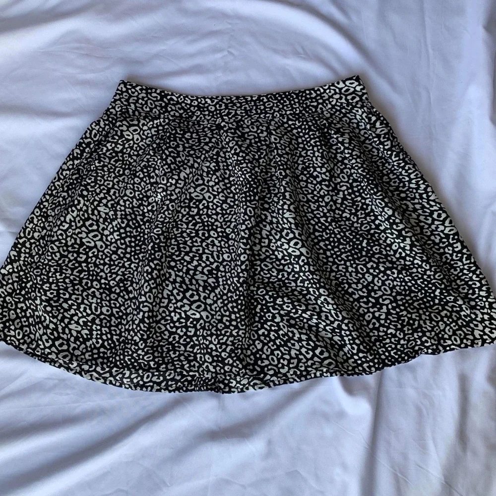 Above the knee black and white skirt